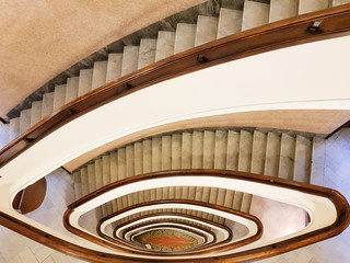 Obraz premium GENOA (GENOVA), ITALY, January 11, 2018 View to the beautiful spiral staircase in building , Spiral circle staircase decoration interior background.