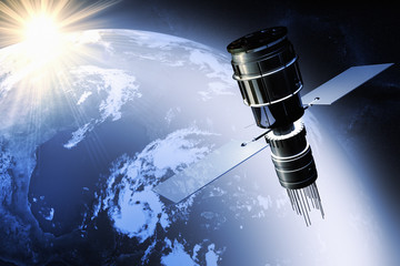 Satellite orbiting the earth at dawn