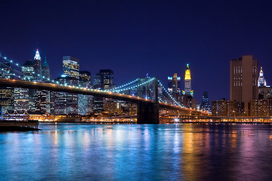 Fototapeta Skyline at night of New York City and Brooklyn Bridge