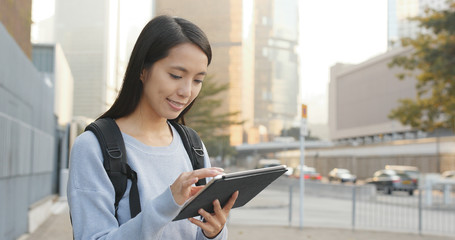 Asian woman using tablet computer at outdoor