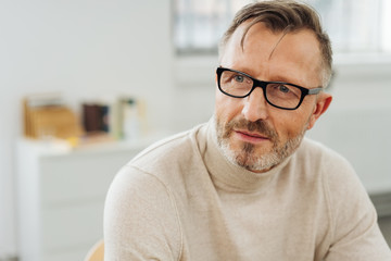 Bearded middle-aged man wearing glasses
