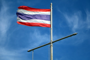 Thailand flag flutter on the blue sky.