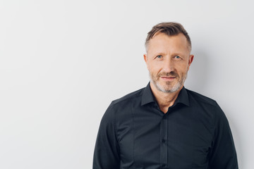 Head and shoulders portrait of a bearded man