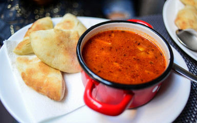 Vegetable soup in red pot