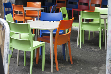 the Multicolored plastic furniture on the street near the cafe