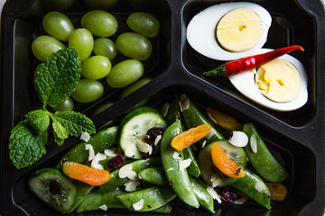 Healthy food and diet concept. Dietary catering. Restaurant dish delivery. Fitness meal. Take away. Fit and eat. Weight loss nutrition in foil boxes.