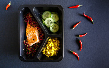 Healthy food and diet concept. Dietary catering. Restaurant dish delivery. Fitness meal. Take away. Fit and eat. Weight loss nutrition in foil boxes.