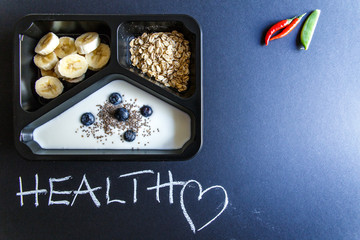 Healthy food and diet concept. Dietary catering. Restaurant dish delivery. Fitness meal. Take away. Fit and eat. Weight loss nutrition in foil boxes.