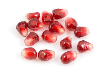 pomegranate seeds isolated on a white background with a clipping path.