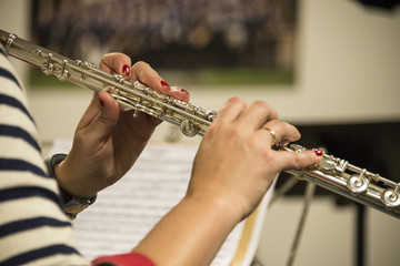 Concert of flutes, hands playing instrument