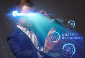 Business, Technology, Internet and network concept. Young businessman working on a virtual screen of the future and sees the inscription: Quality assurance
