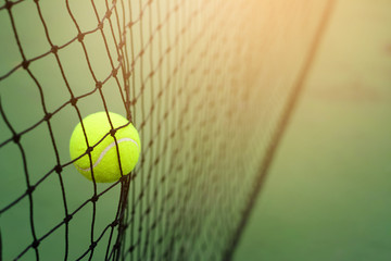 Close up Tennis ball hitting to net