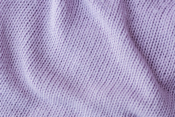 Fototapeta na wymiar Lilac knitting wool texture background.