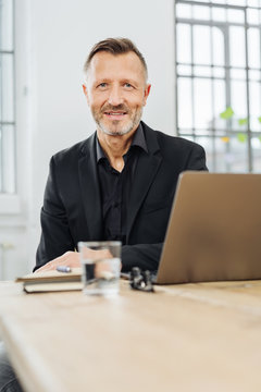 Businessman sitting at an office table