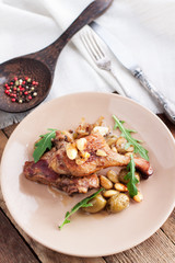 Braised duck with almonds and olives
