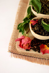 Leaf tea, dried rose and fresh mint for making a hot drink