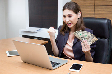 Businesswoman excited when shares is up.