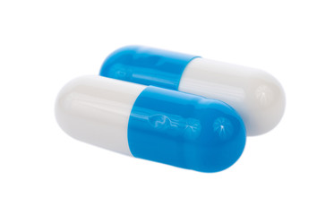 blue pills capsules isolated on white background