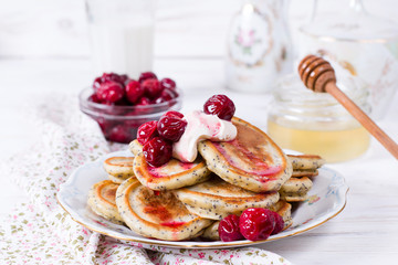 Homemade stack of pancakes with cherries for tasty healthy breakfast