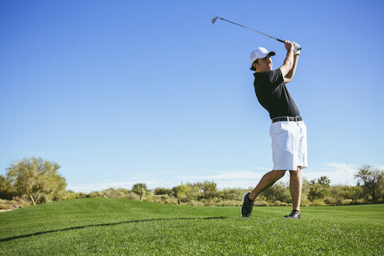 Man playing golf on a golf course