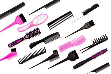 Hairdressing tools. Pattern with various combs and brushes on white background top view