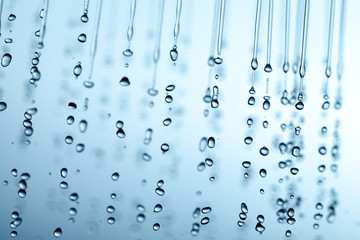 Naklejka na ściany i meble Falling transparent water drops.