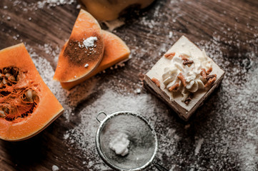 pumking cake on wooden dack background with cream.