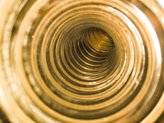 Flexi air hose, plastic flexible tube, piping on an abstract background.