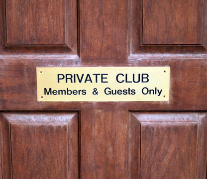 Private club door sign for members and guests.
