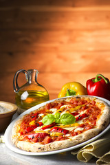 Pizza with peppers on the table