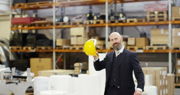 4k, Portrait of a cheerful and friendly male warehouse manager. Slow motion