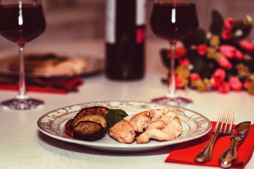 Romantic dinner for two with wine,meat and flowers