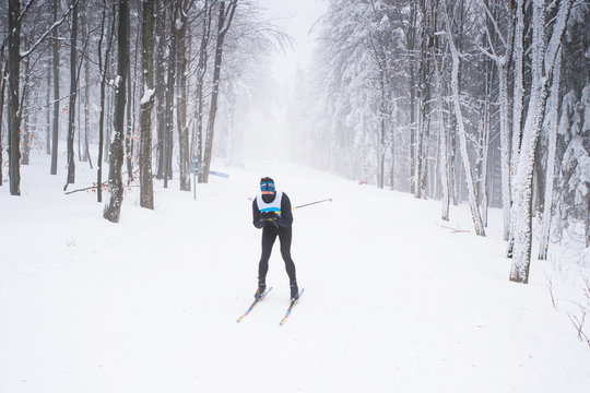Professional nordic skier in white winter nature