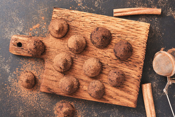 Delicious candy truffles sprinkled with cocoa powder ,top view.