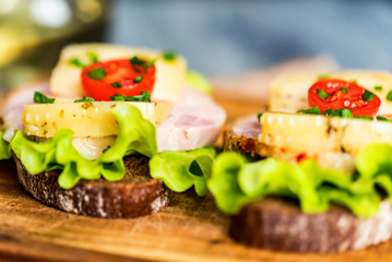 Sandwiches with cheese, turkey, lettuce and tomato