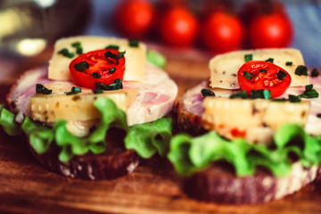 Sandwiches with cheese, turkey, lettuce and tomato