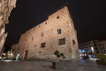 Casa de las conchas at night in Salamanca, Spain.