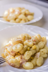Healthy light gnocchi with ham and vegetables.
