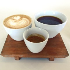 Cappuccino espresso and coffee on a tray with a white background