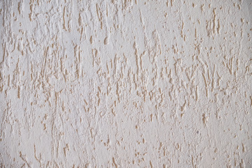 Texture background with decorative relief plaster on the wall