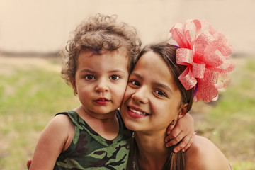 Boy and happy girl smiling at camera