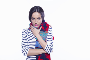 Concept of the disease. Medicines and treatments. Young woman with a painful look in a warm scarf, the girl coughs.