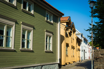 Row of typical wooden scandinavian houses on little town street