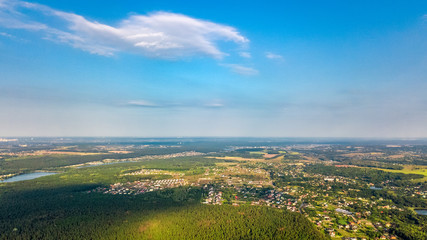 Aerial top view of residential area summer houses in forest from above, countryside real estate and small dacha village in Ukraine 