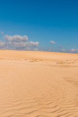Fototapeta na wymiar Clouds over the Corralejo sand dunes in Fuerteventura, Canary Islands