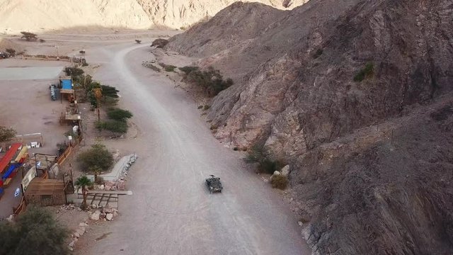Armed military patrol clearing a route - Aerial footage