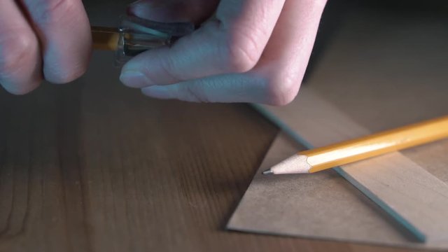 Sharpen the pencil. Slow motion. 