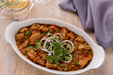 meat and vegetables in tomato sauce, Georgian dish, chashashuli