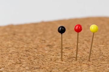 pins in pin board in german colors black, red, gold,