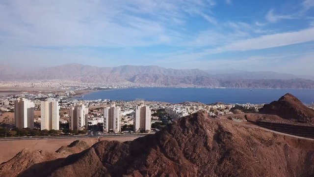 Eilat, Israel - Aerial footage over Solomon's mountains, revealing Eilat's skyline and the red sea